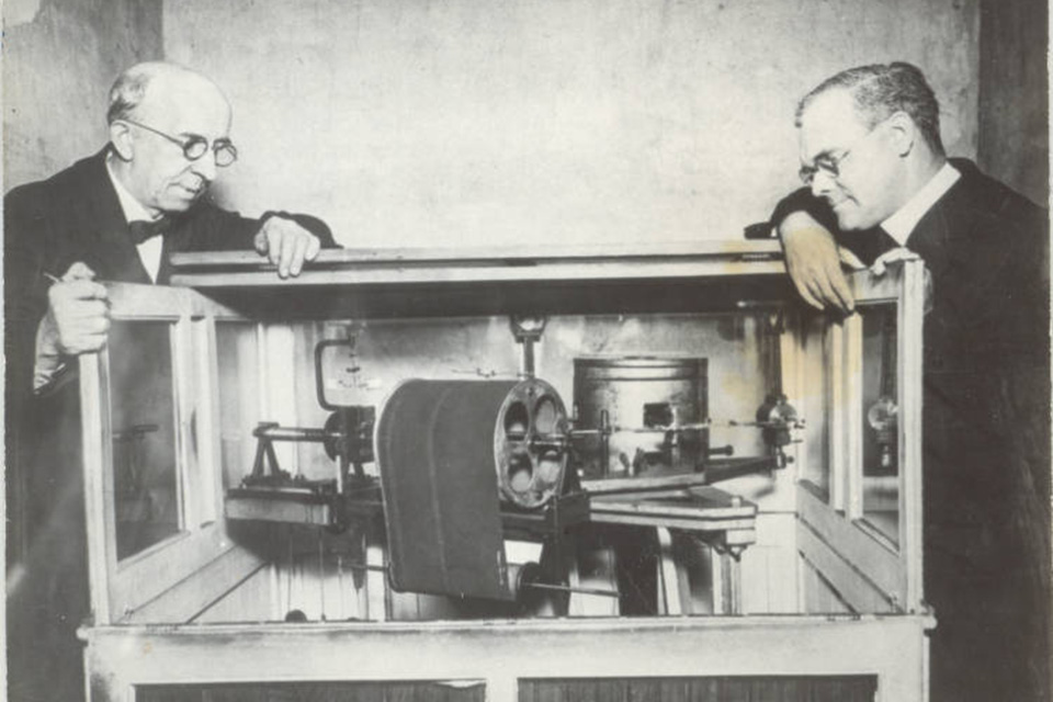 Seismograph Two men examine SLU’s Seismograph in the basement of DuBourg Hall .