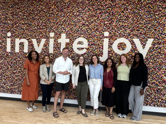 PRiME Center Team Photo of PRiME Center Team in front of a mural that says invite joy