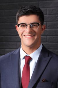 Headshot of Amer Qolaghassi
