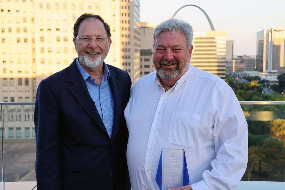 Richard A. Chaifetz School of Business Dean Jackson Nickerson, Ph.D., left, and 2025 John A. Slosar Shared Governance Award winner David Kaplan, Ph.D.