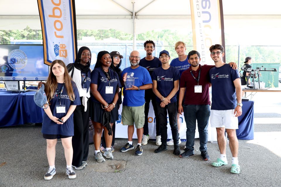 The AirCRAFT Lab team poses with their award at the 2025 Student Unmanned Aerial Systems Competition.